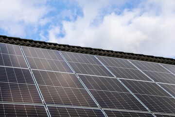 Photovoltaic panels providing sustainable energy on a residential rooftop