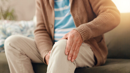 Senior man, sofa and knee pain with injury for chronic illness, arthritis or fibromyalgia at home....