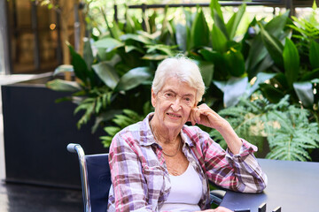 Senior woman enjoying serene time in a lush natural environment