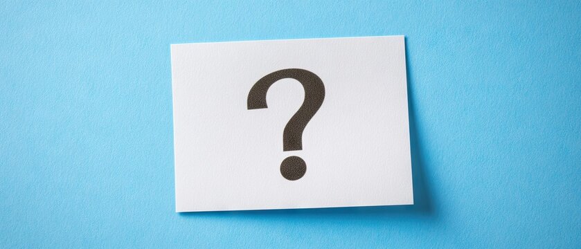 A white rectangular piece of paper with a large black question mark printed on it, set against a light-blue background