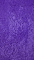 Purple faux fur background creating soft texture