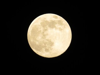 Full moon close-up against black night sky