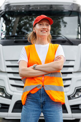 Portrait young adult happy smiling woman heavy truck driver modern cargo vehicle cabin background. Female person girl professional job career working driving freight engine lorry. Logistics industry