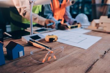 Engineers are helping to design work on blueprints and collaborate on structural analyzing of project types.