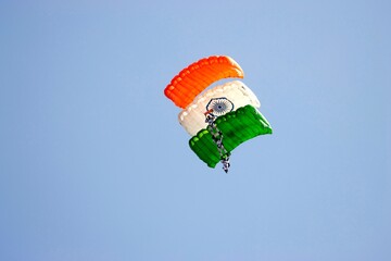 Parachutists presenting the Indian tricolour at the Aero India show, India