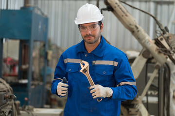 Industry factory, engineer and workshop. Portrait of male engineer wearing safety uniform, hard hat...
