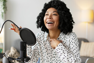 Podcaster laughing during a live recording