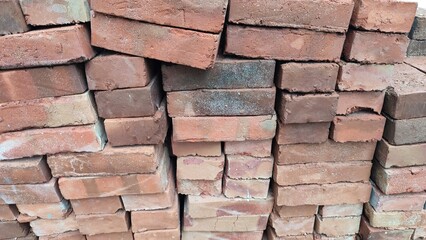 pile of bricks for construction, red brick made of clay