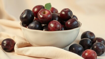 Vibrant Bowl of Plump Purple Plums