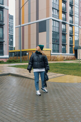 Young woman explores urban environment wearing a winter outfit in early morning light