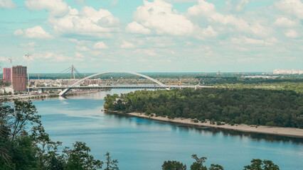 Scenic drone view of Kyiv skyline with Dnipro river and bridges