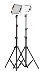 Professional lighting equipment with tripods isolated on white