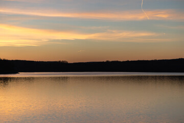 Sunrise at the lake - sun reflections in the water