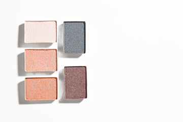 Beautiful eyeshadow refill pans on white background, flat lay. Space for text