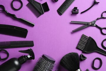 Frame of different hairdresser's tools on violet background, flat lay. Space for text