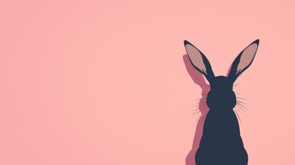 Obraz premium minimalistic black bunny silhouette on pastel pink background, clean design, stock photo style