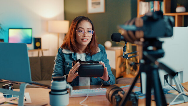 Influencer, talking and woman with vr headset live streaming for broadcast, entertainment and vlog. Content creator, social media and person recording video, podcast and review to audience in home