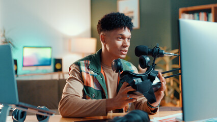 Man, influencer or gamer streaming with vr goggles for online tutorial or guide at home. Male...