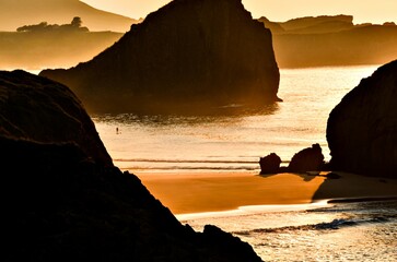 Spectacular sunset with an orange sky on a beach in Asturias, Cantabrian Sea, Spain