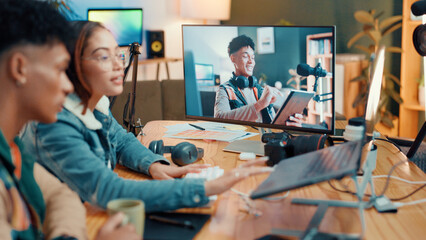 Influencer, team and editing with screen, laptop and production for video review. People, monitor and discussion for content creation, broadcast or freelancer in house for social media podcast