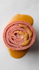A detailed close-up of a roulade slice with creamy layers on white – roulade wallpaper – bakery wallpaper – roulade image

