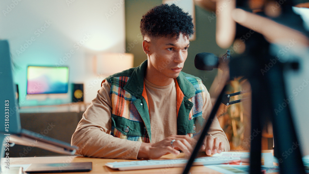 Poster Man, streamer and computer in home with typing, mic or review with script editing for video production. Gen z influencer, reading and pc for feedback, click or chat with fans on social media at house