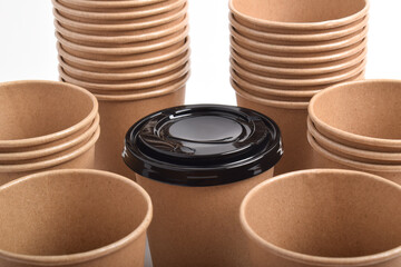 Stack of the brown disposable cups isolated on white background.
