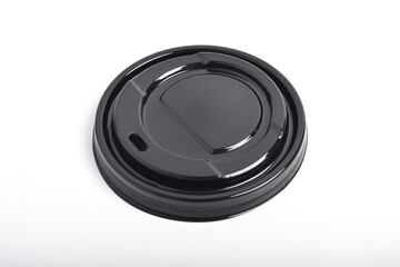 Black plastic cap. Plastic lid for a cup solated on white background with clipping path