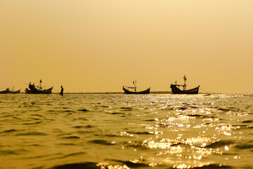 traditional fishing boats at sunset. cox's bazar, bay of bengal, Bangladesh