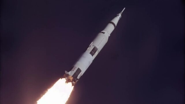 Saturn V rocket flying towards the moon.