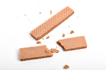 Chocolate wafer with crumbs isolated on white background.