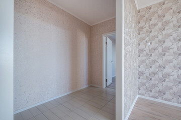 long empty corridor in interior of entrance hall without furniture of modern apartments, office or...