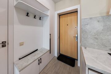 long empty corridor in interior of entrance hall without furniture of modern apartments, office or...