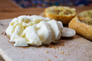 Mozzarella and garlic Bread on wooden plate for mediterranean breakfast
