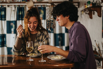 Friends sharing a delightful meal together at an inviting bar setting, enjoying wine and laughter in a warm and friendly ambiance. The moment captures joy, connection, and casual dining indoors.