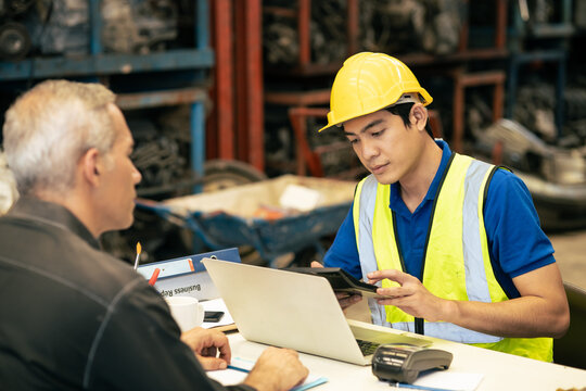 Technician engineer man working at desk calculate cost expense for metal spare part to customer in industry market