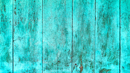 Cracked and weathered turquoise paint on old wooden surface. Perfect rustic background for design projects, websites, posters, and vintage-style artwork.