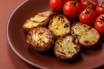 Food, potatoes cut in halves or slices grilled. Cooked baked potatoes