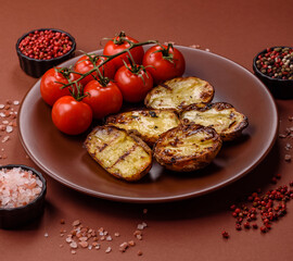Food, potatoes cut in halves or slices grilled. Cooked baked potatoes
