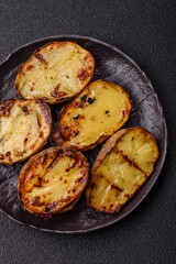 Food, potatoes cut in halves or slices grilled. Cooked baked potatoes