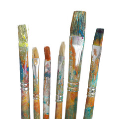Brushes with different paints isolated on white