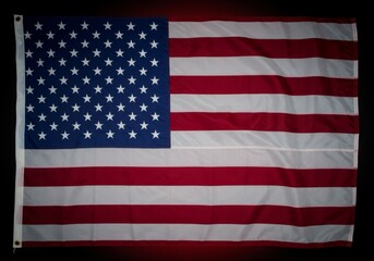 Top view of American flag on dark blue studio background with copy space