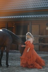 young woman in a dress with a horse