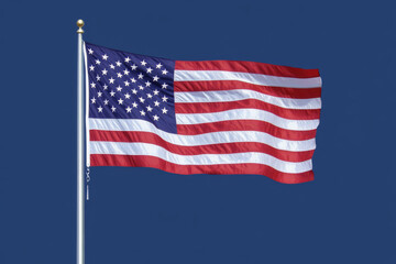 Obraz premium Top view of American flag on dark blue studio background with copy space