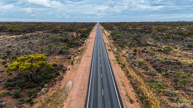 Aerial of straight road into the distance