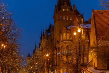 Fototapeta premium Christmas lights illuminating prague street Parizska at twilight