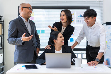 Happy diverse group Asian business team analyzing statistics financial. Group Team of business people meeting conference discussion various topic corporate concept in office.