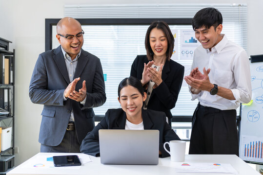 Happy diverse group Asian business team analyzing statistics financial. Group Team of business people meeting conference discussion various topic corporate concept in office.