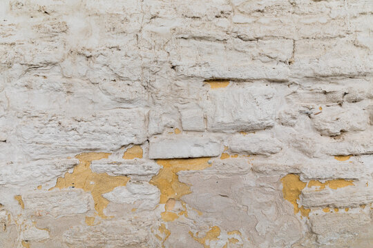 Fototapeta Rough white rendered stone brick wall