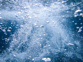 Air bubbles underwater rising to water surface, natural scene, bubbles under water, bubble undersea, sea in crystal clear green water. Real image very suitable for backgrounds, Great for background.